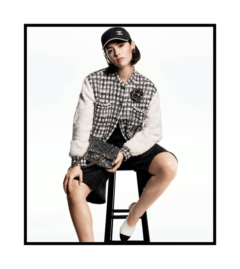 Gracie Abrams wears a baseball cap in Chanel's spring 2025 ad.