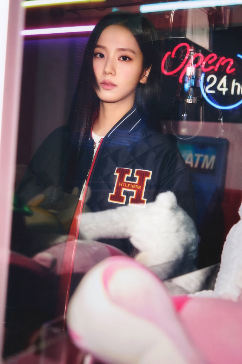 Posing with neon lights, Jisoo wears a varsity jacket in a Tommy Hilfiger photoshoot.