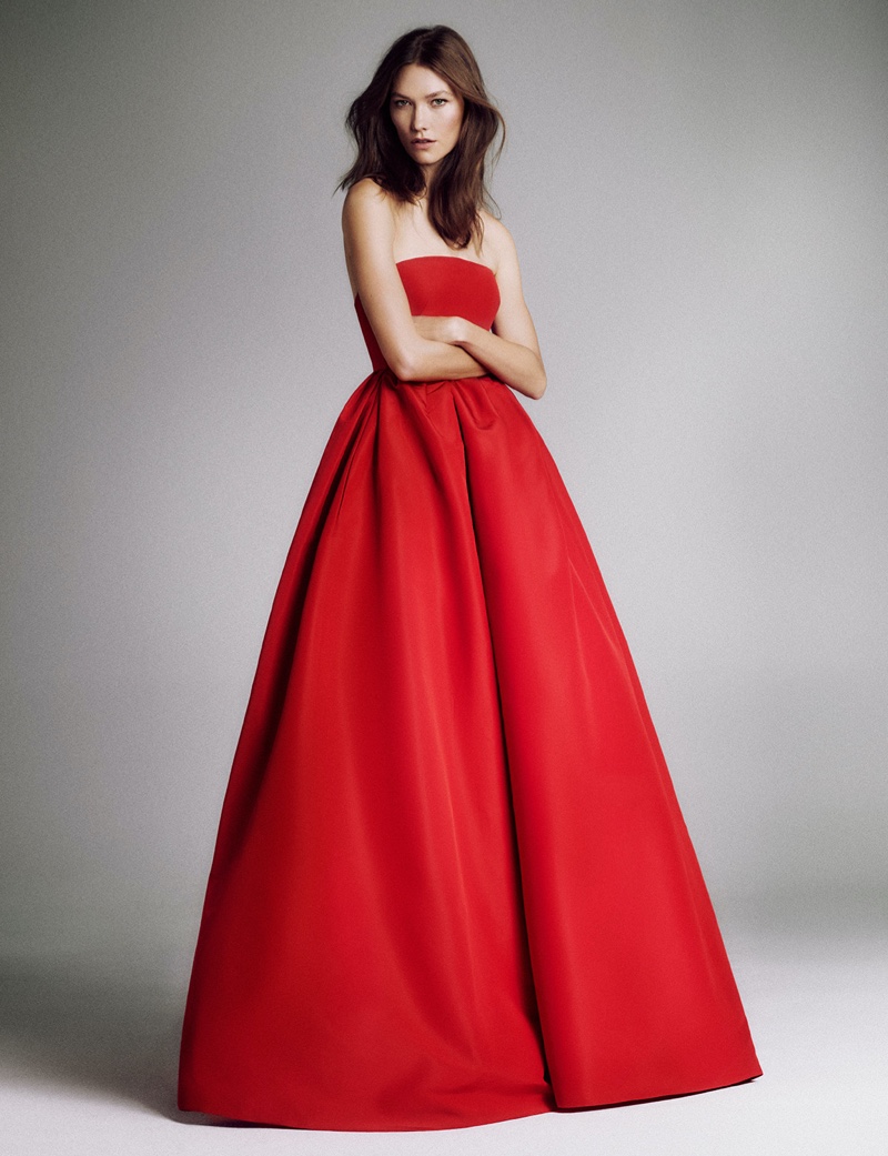 Supermodel Karlie Kloss wears a red Carolina Herrera gown.