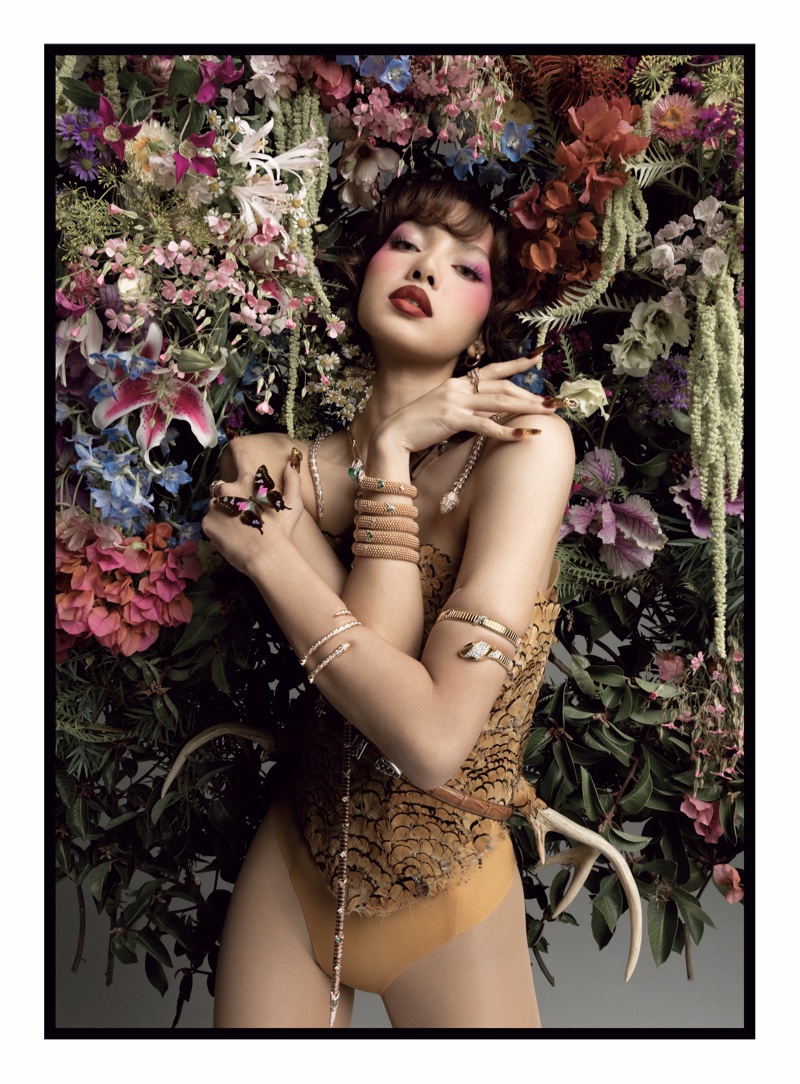 Blackpink's Lisa wears SEKS corset with feathers and Bulgari jewelry.