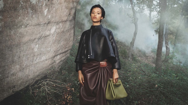 Posing in the woods, Taylor Russell fronts Loewe's spring 2025 campaign.