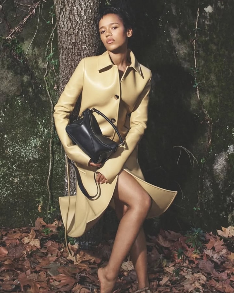 Actress Taylor Russell poses in sleek outerwear for Loewe's spring campaign.