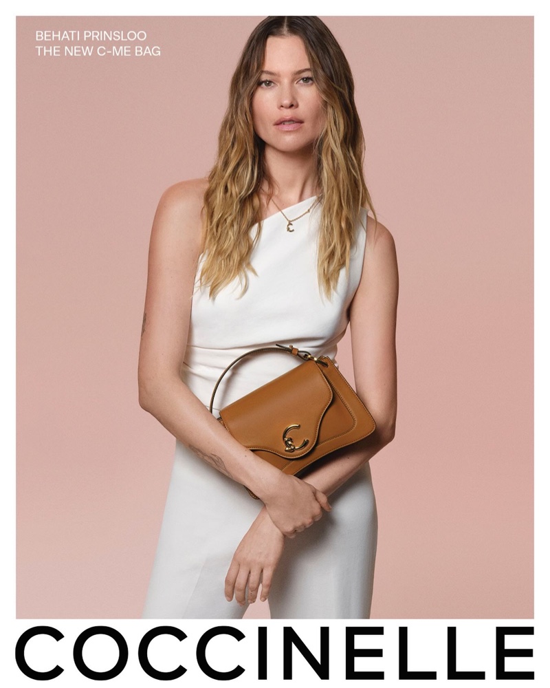 Behati Prinsloo poses with Coccinelle's C-Me bag.