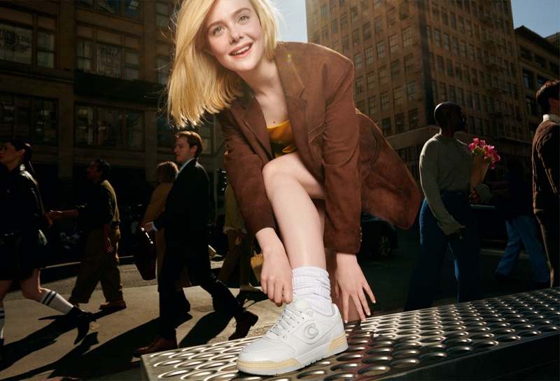 Elle Fanning shows off sneakers in Coach's On Your Time campaign.