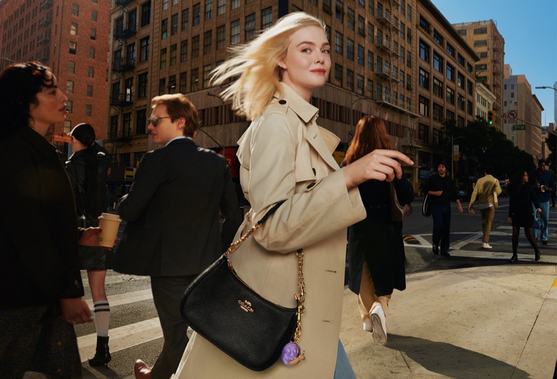 Actress Elle Fanning wears a trench coat for Coach's spring 2025 campaign.