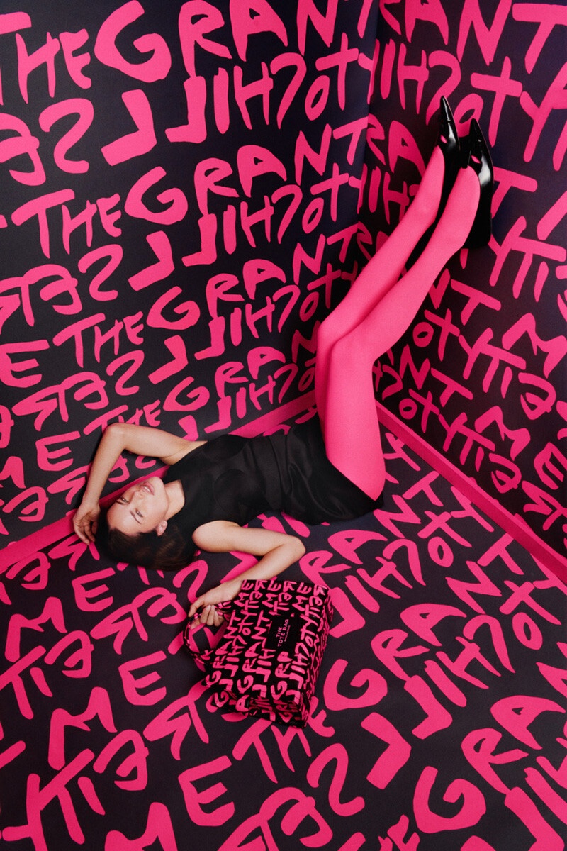 Posing in a graffitied room, Adriana Lima models for Marc Jacobs.