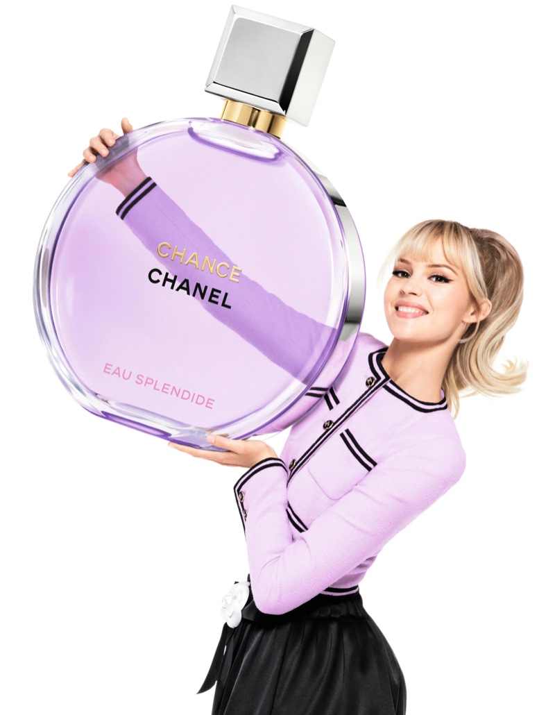 Angèle poses with the Chanel Chance Eau Splendide bottle.